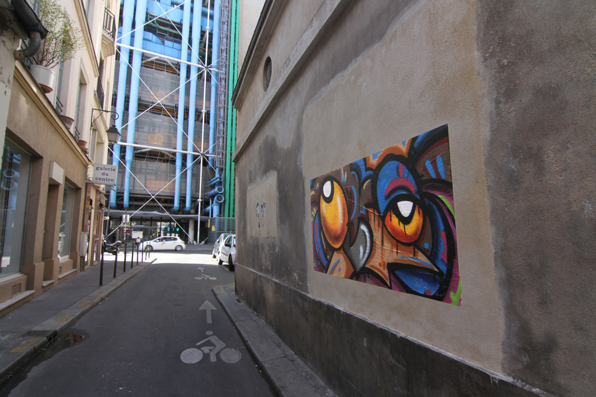 Nite Owl street art wheat paste in Paris, France